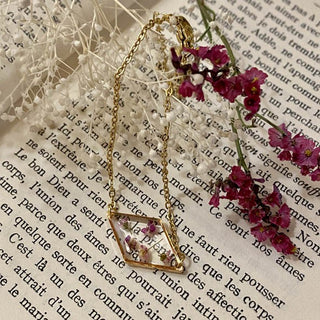 Bijoux vraies fleurs Clermont - Bracelet losange en acier inoxydable doré avec fleurs d'alysse